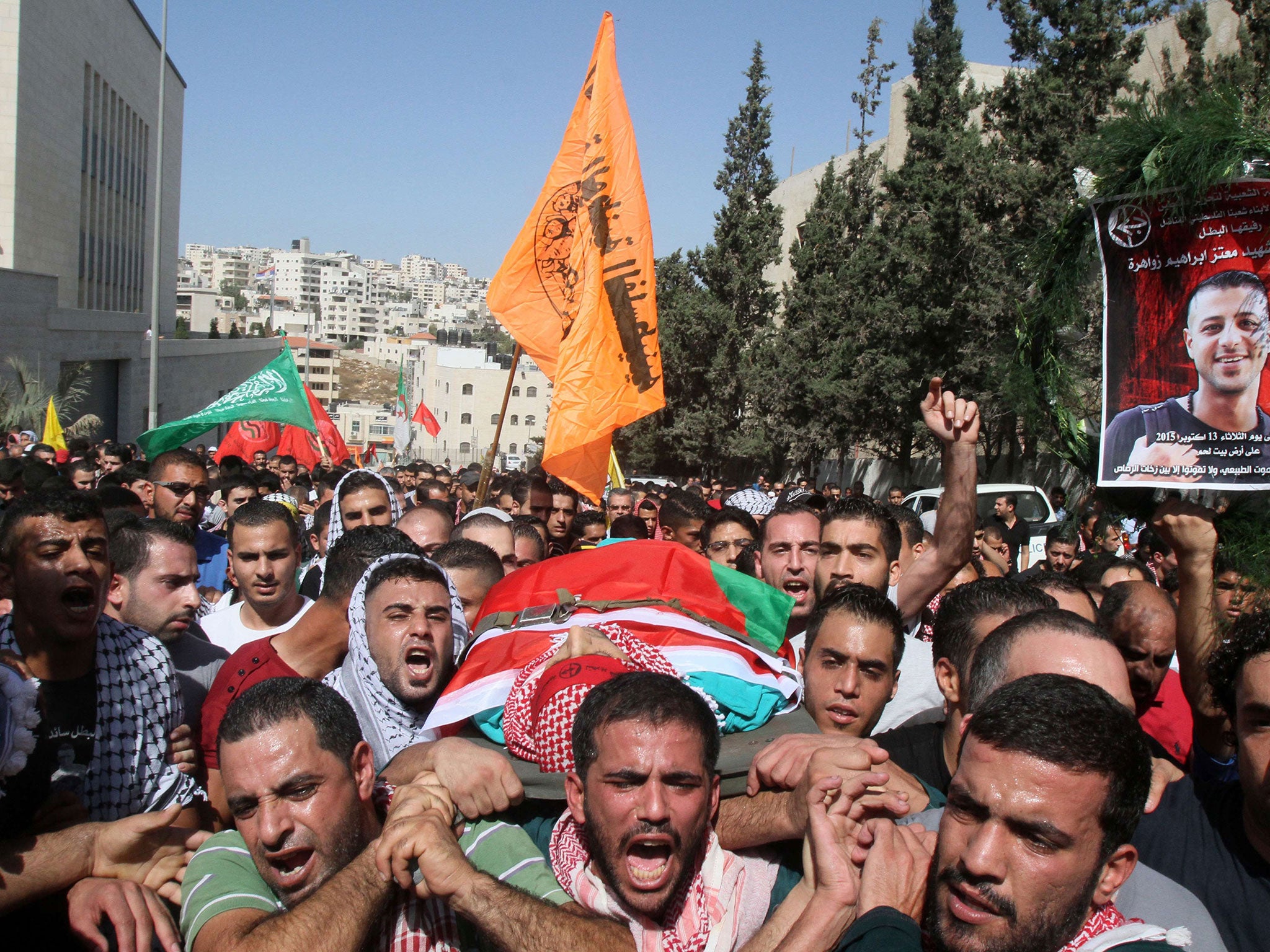 The funeral of Moataz Zawahra, a 28-year-old Palestinian who was killed in clashes with Israeli security forces, near Bethlehem on 14 October
