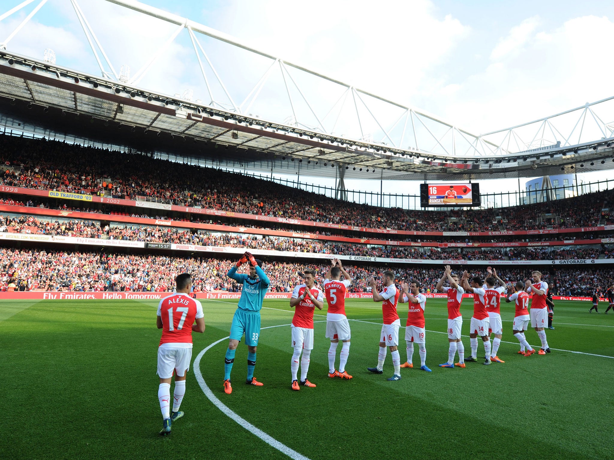 Arsenal players acknowledge the fans at the Emirates