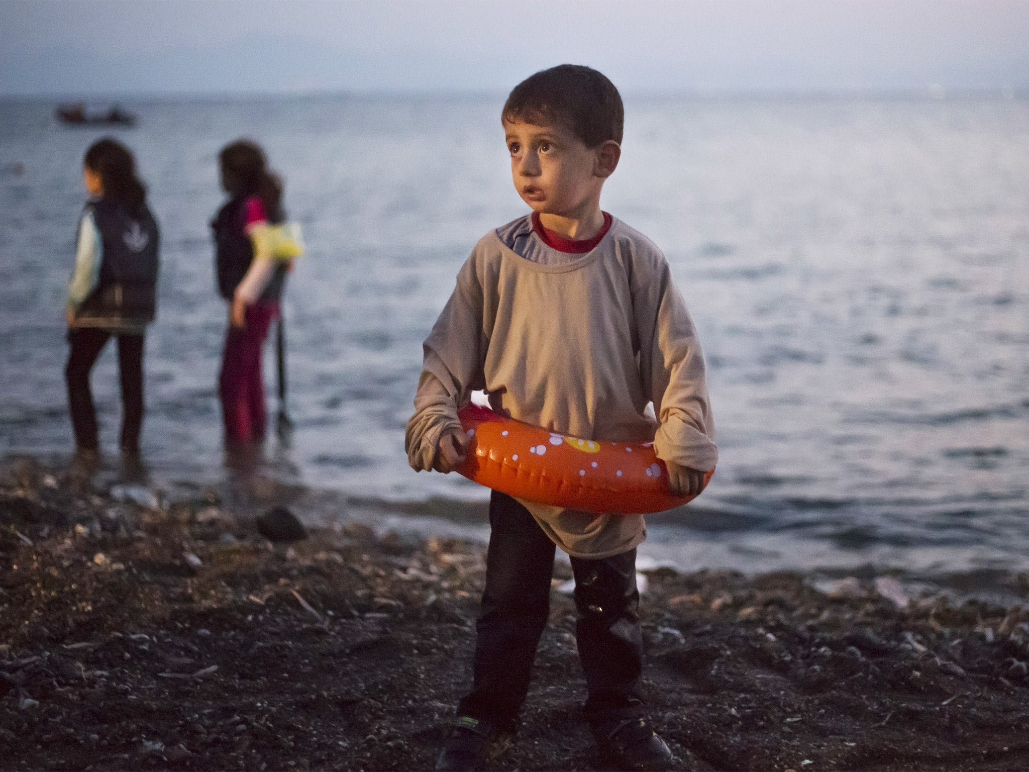 A young Syrian boy arrives on the island of Kos, which is struggling to cope with the record numbers of refugees