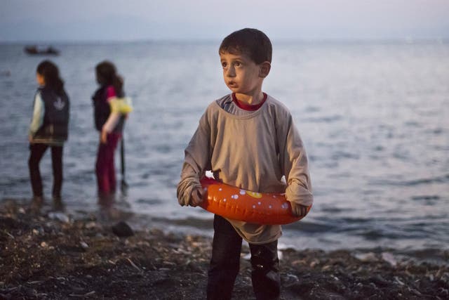 A young Syrian boy arrives on the island of Kos, which is struggling to cope with the record numbers of refugees