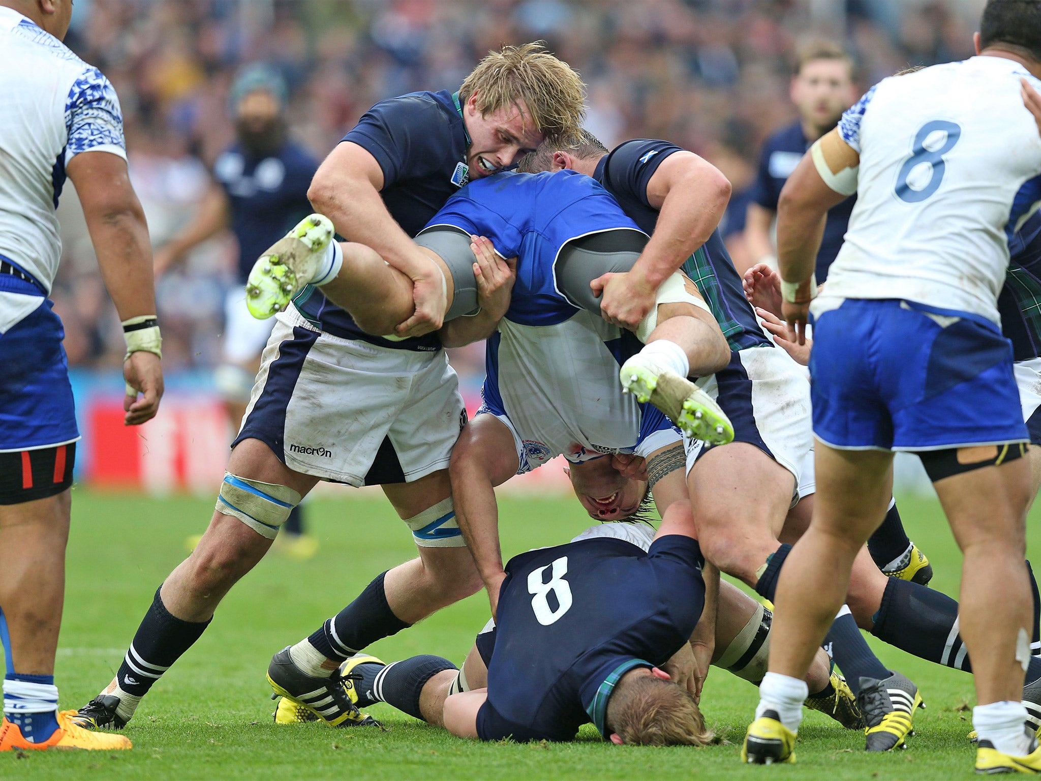Jonny Gray and Ross Ford tackle Samoa’s Jack Lam last weekend
