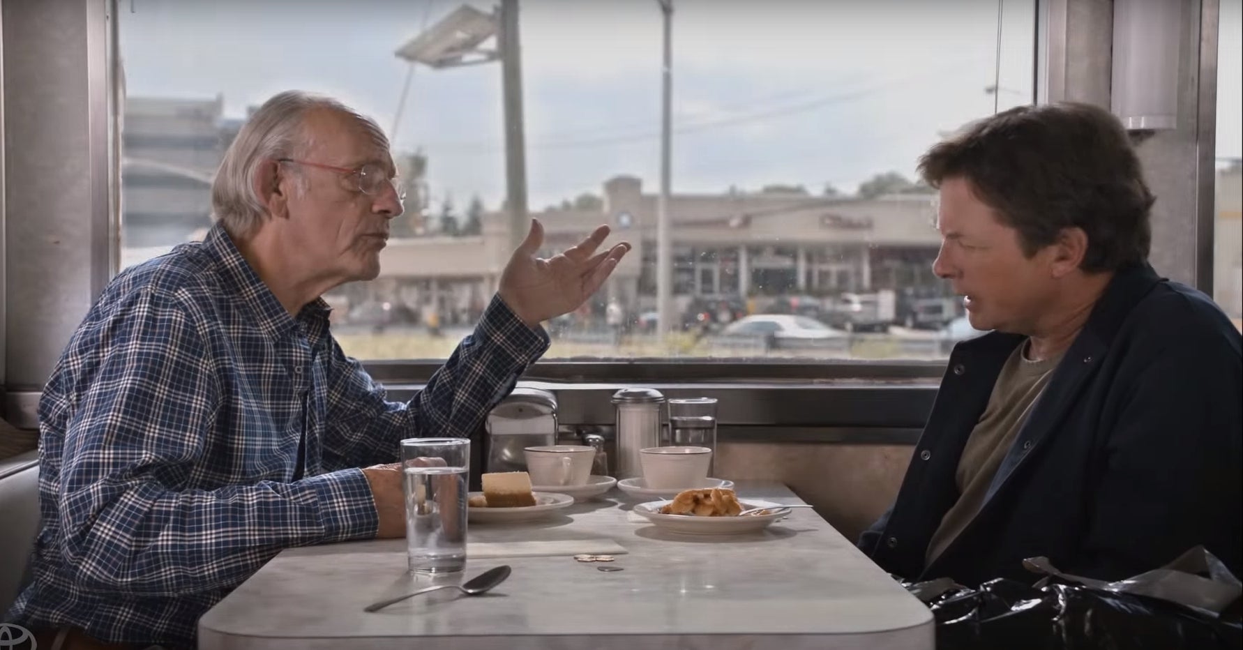 Michael J. Fox and Christopher Lloyd discussing Back to the Future II