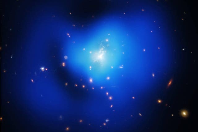 A galaxy cluster, like this one, is thought to contain vast amounts of dark matter that cannot be seen but has a gravitational effect