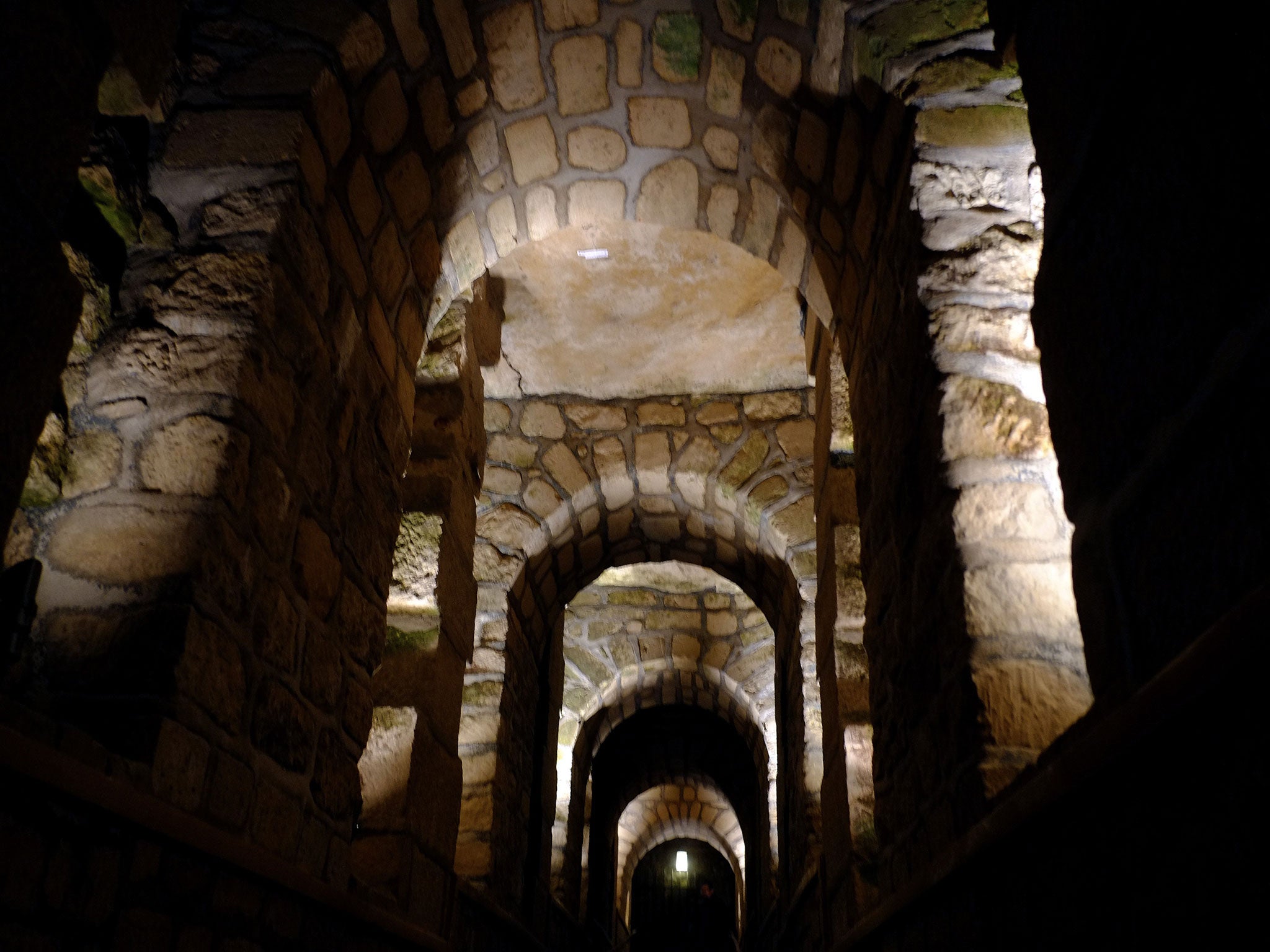 The catacombs are housed in historical limestone quarries beneath the streets of Paris
