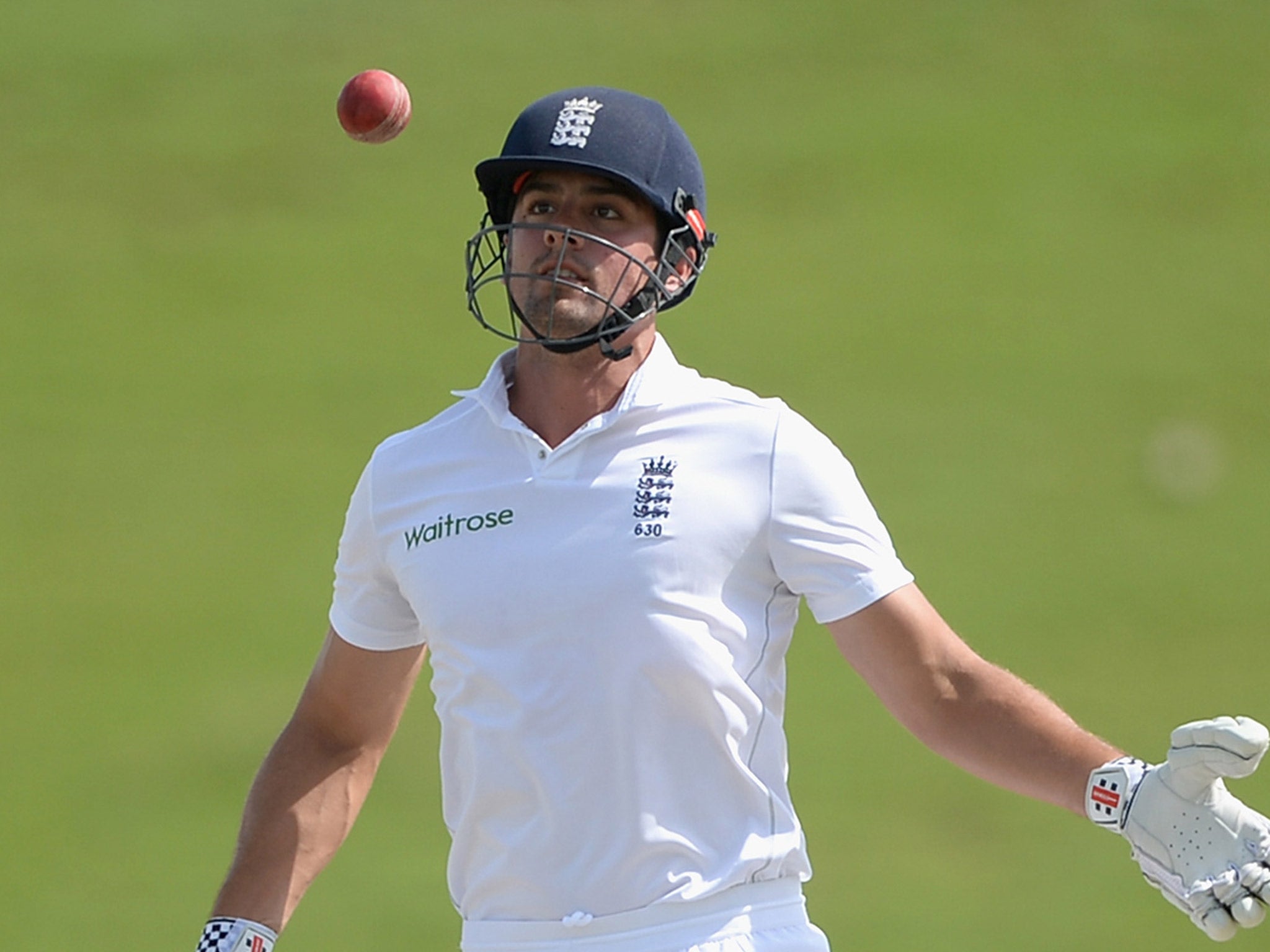 Cook watches the ball after mistiming a shot on the third day of the First Test