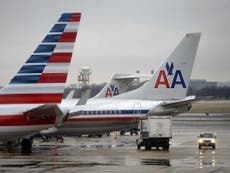 American flight crew booed by passengers after woman booted off plane