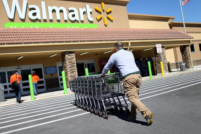 A lower earnings outlook saw Wal-Mart shares tumble 10 per cent