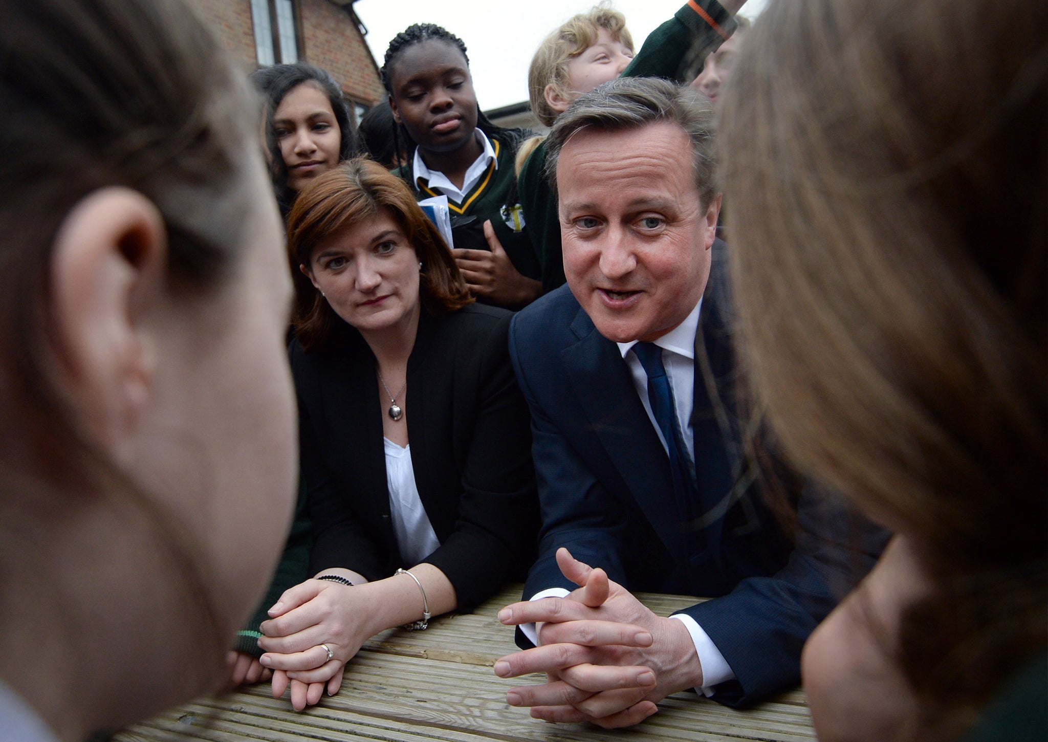 David Cameron and education secretary Nicky Morgan meet pupils during a visit to the Green School For Girls on March 9, 2015 in London