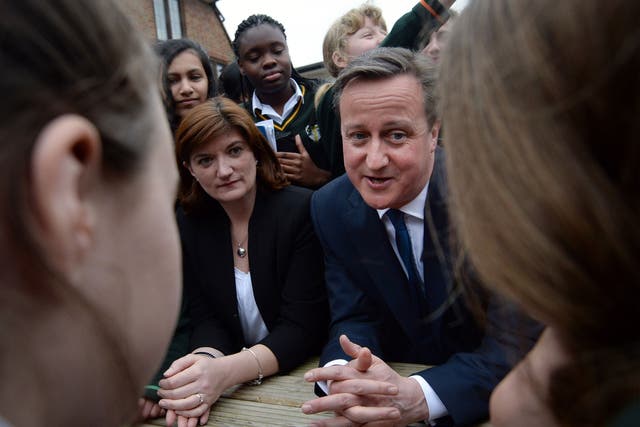 David Cameron and education secretary Nicky Morgan meet pupils during a visit to the Green School For Girls on March 9, 2015 in London