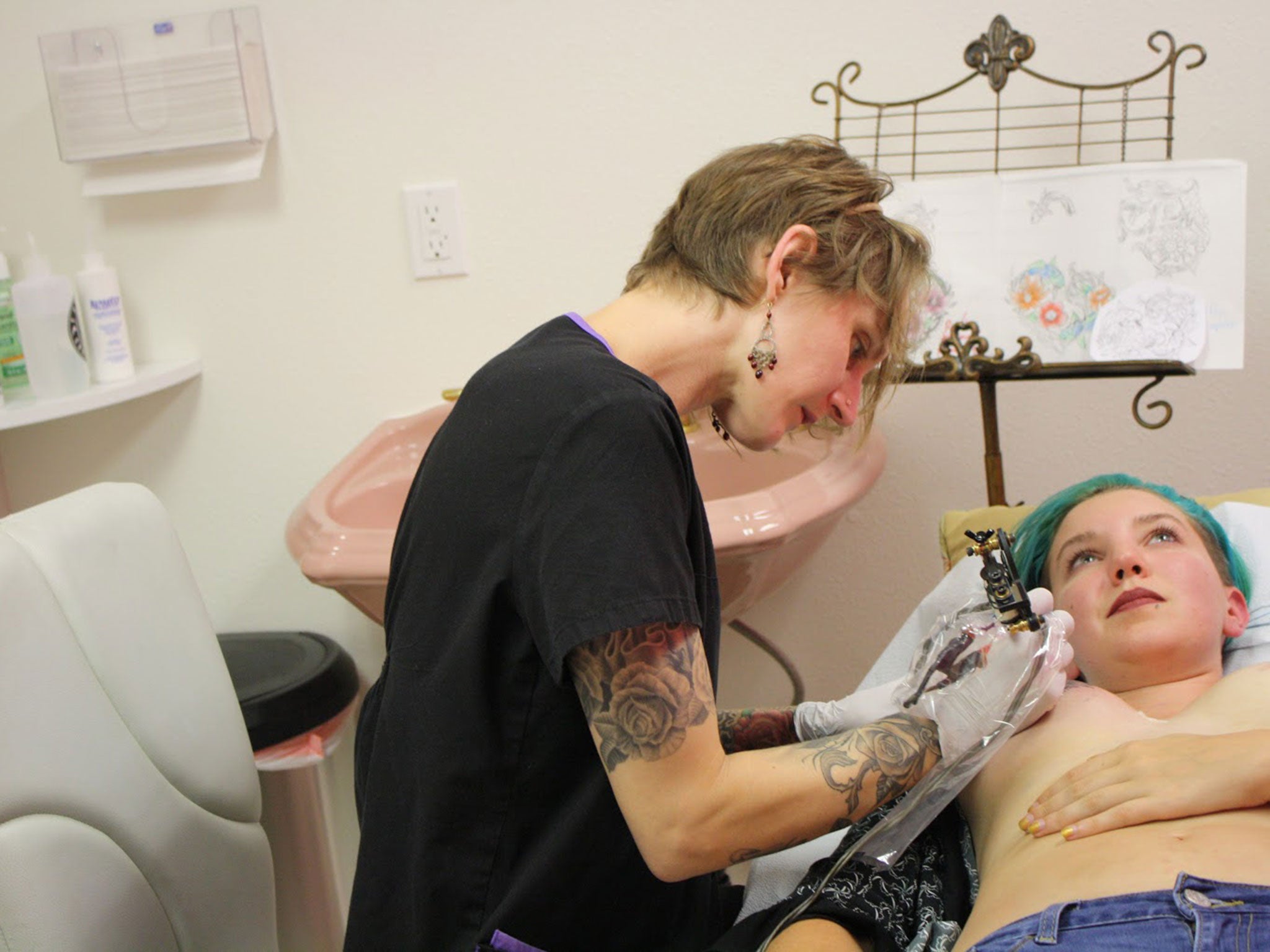 Nikki being tattooed at The Gilded Lily Design