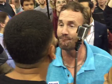 Donald Trump supporter 'spits' on immigration activist at rally