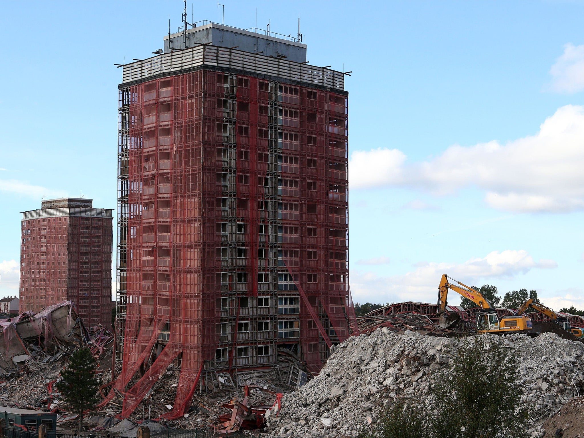 Two blocks of the Red Road flats in Glasgow left partially standing after a controlled demolition of the iconic flats on Sunday failed to bring down two of them.
