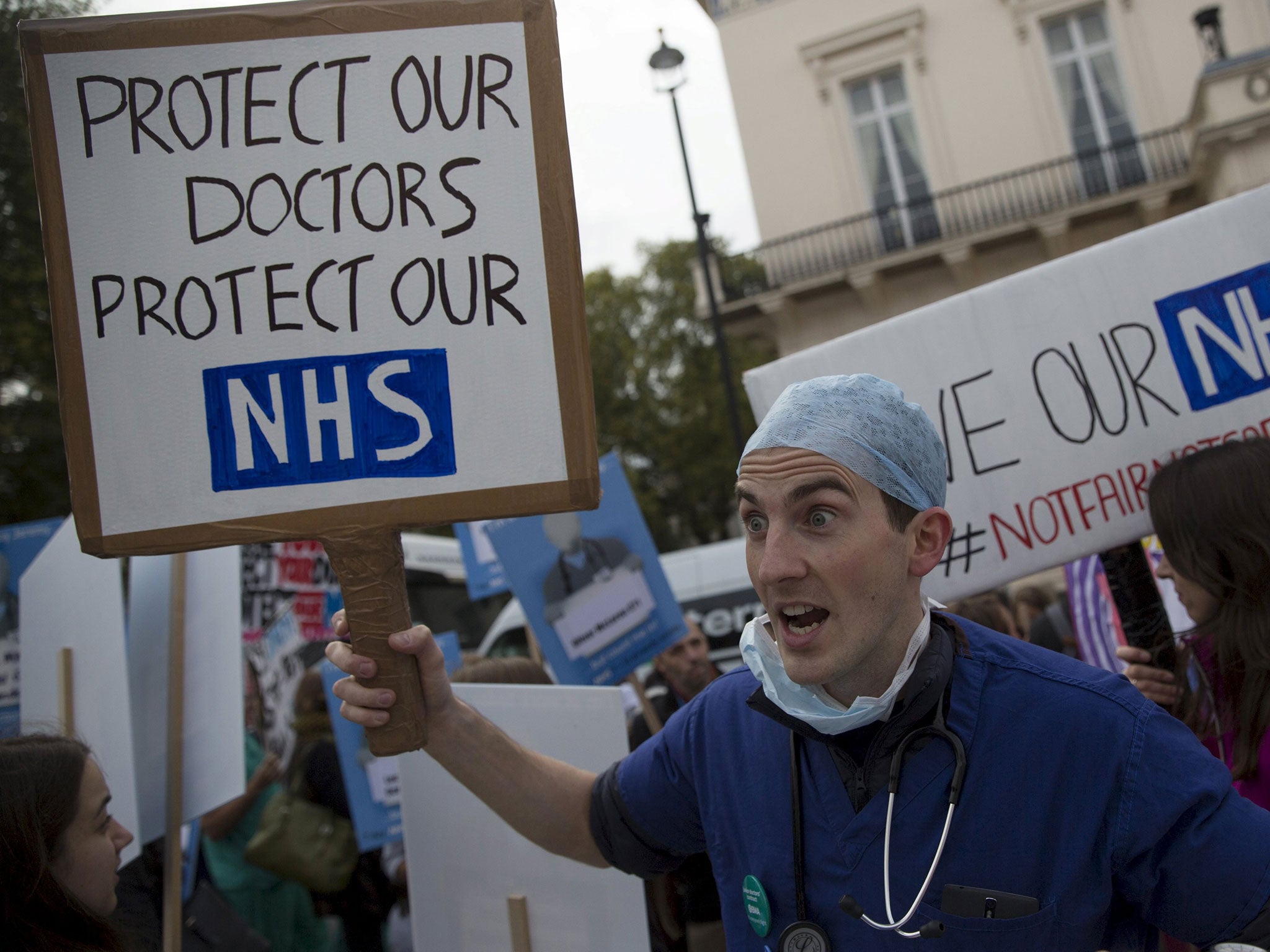 Demonstrators march down Whitehall during the 'Let's Save the NHS' protest by junior doctors in London last month