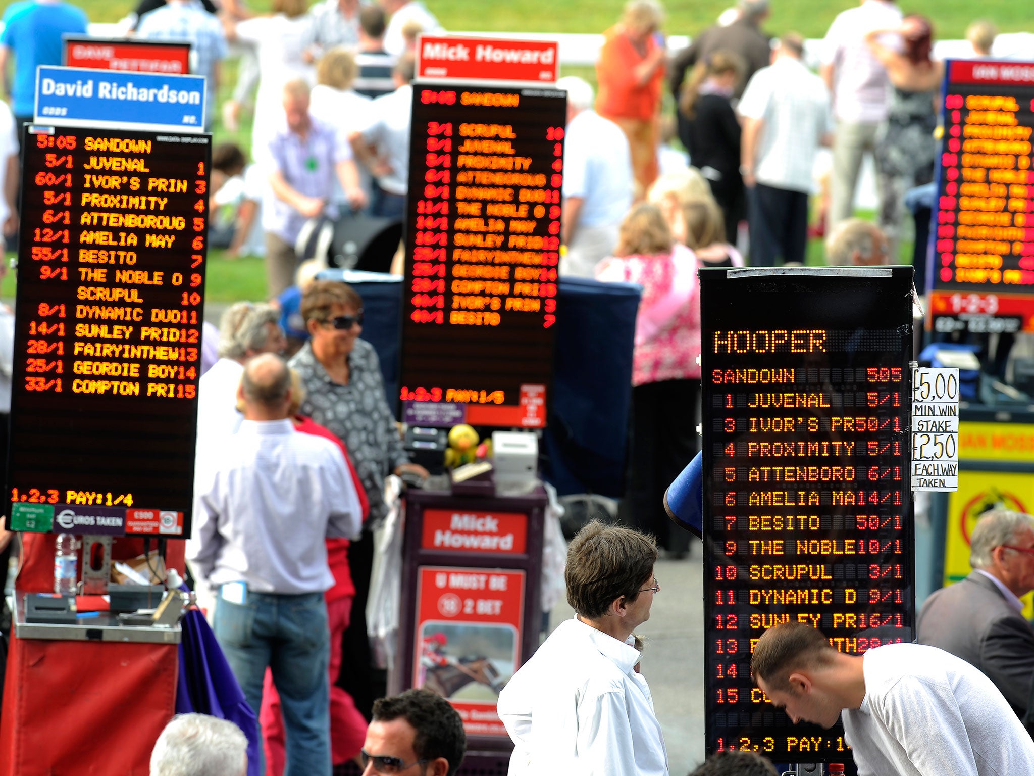 Bookmakers gather beside the track at the 2015 Grand National. Could they predict the EU referendum result?