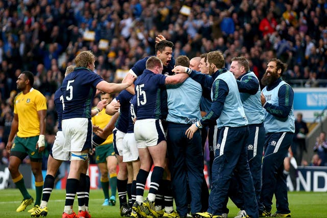 Scotland celebrate after Peter Horne scores a try against Australia
