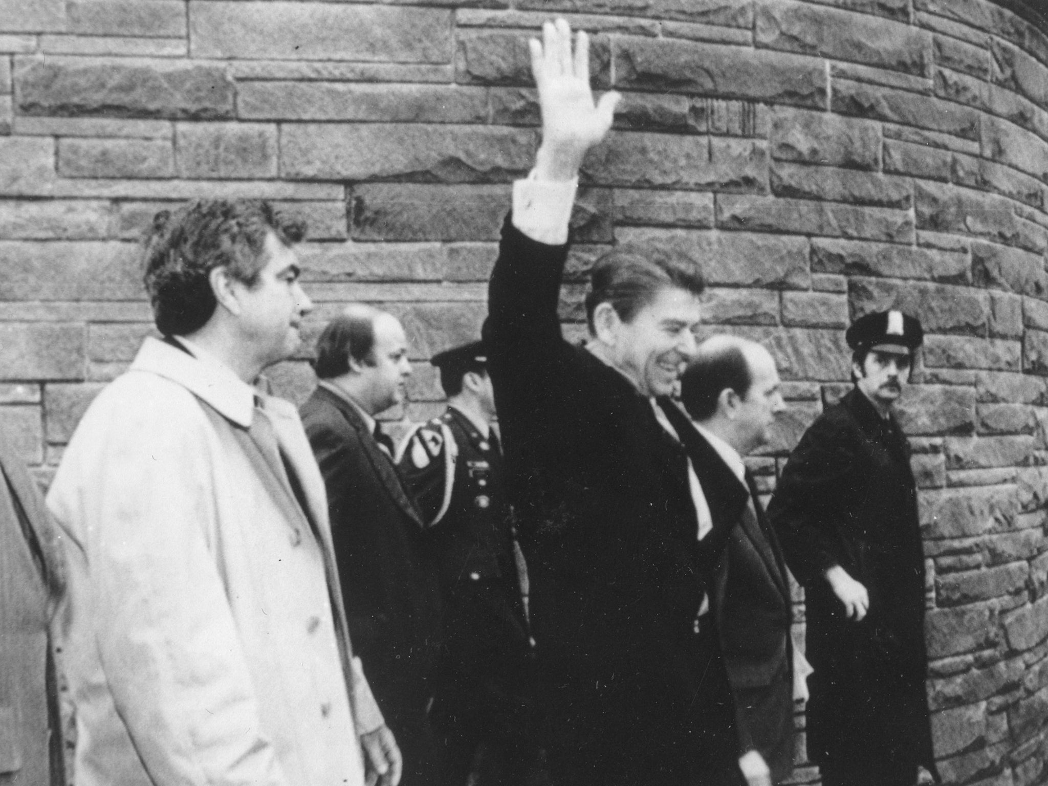 Parr, left, with President Reagan outside the Washington Hilton Hotel in 1981 moments before a gunman opened fire