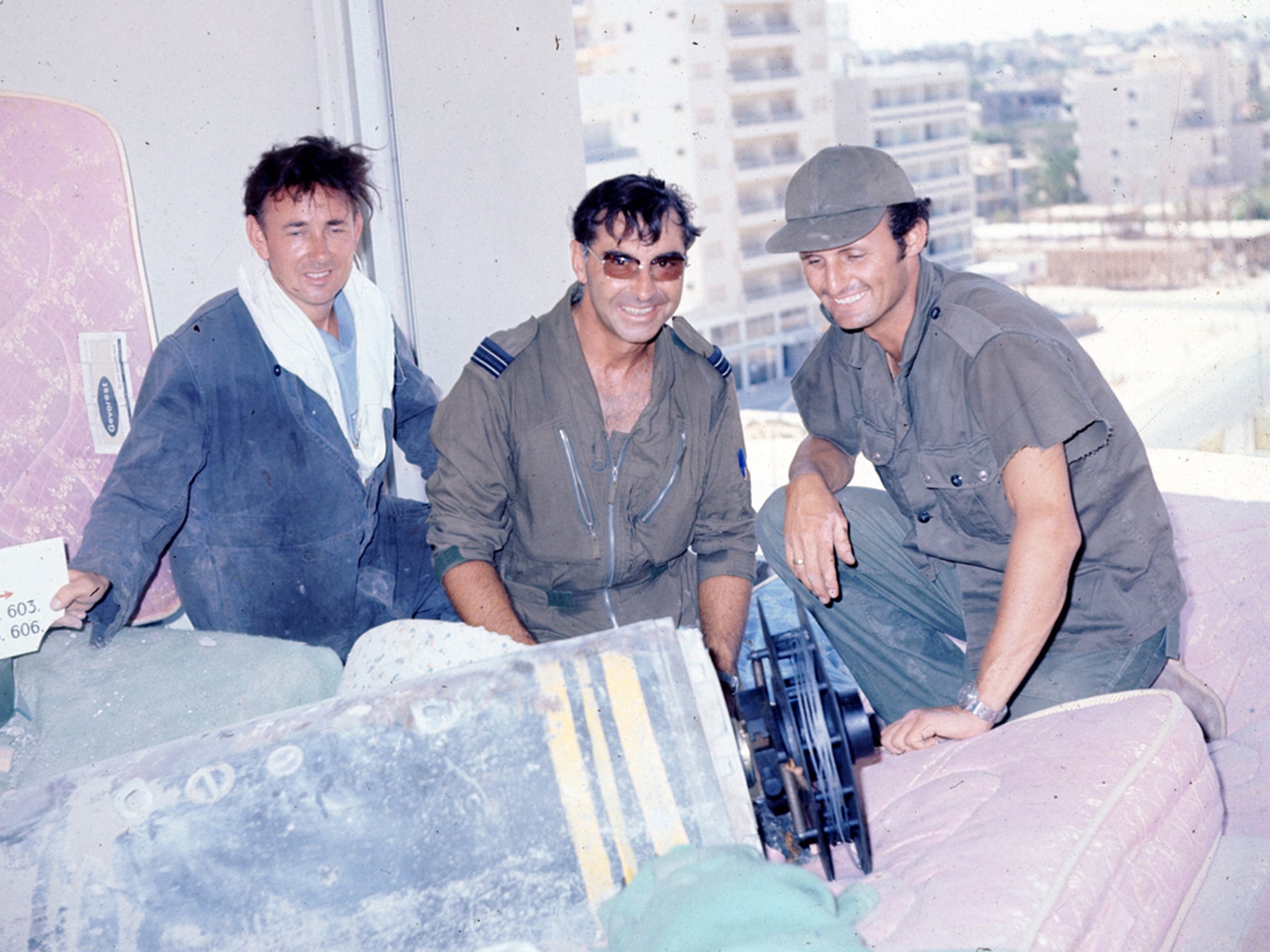 Costick, centre, and two comrades: they often had to work under fire from the Turkish Army and the Cypriot National Guard