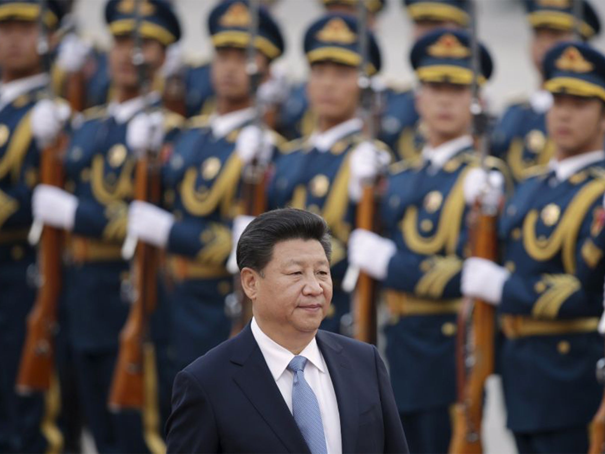 China's President Xi Jinping inspects honour guards during a welcoming ceremony outside the Great Hall of the People in Beijing, China.