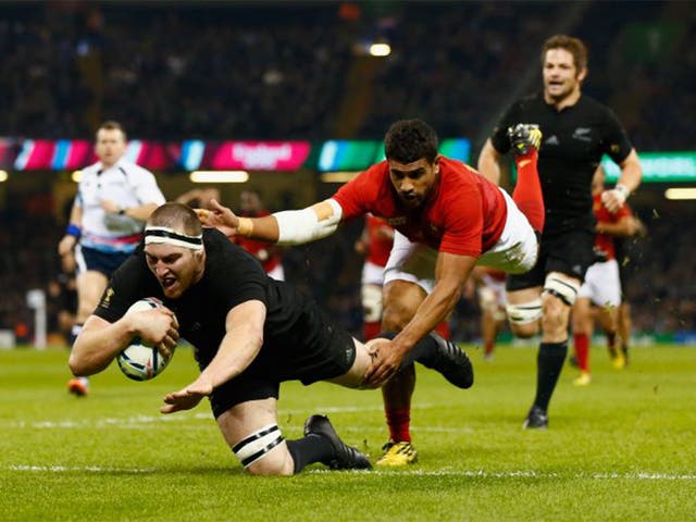 Brodie Retallick of the New Zealand All Blacks dives over the line to score the first try during the 2015 Rugby World Cup Quarter Final match between New Zealand and France