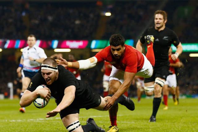 Brodie Retallick of the New Zealand All Blacks dives over the line to score the first try during the 2015 Rugby World Cup Quarter Final match between New Zealand and France