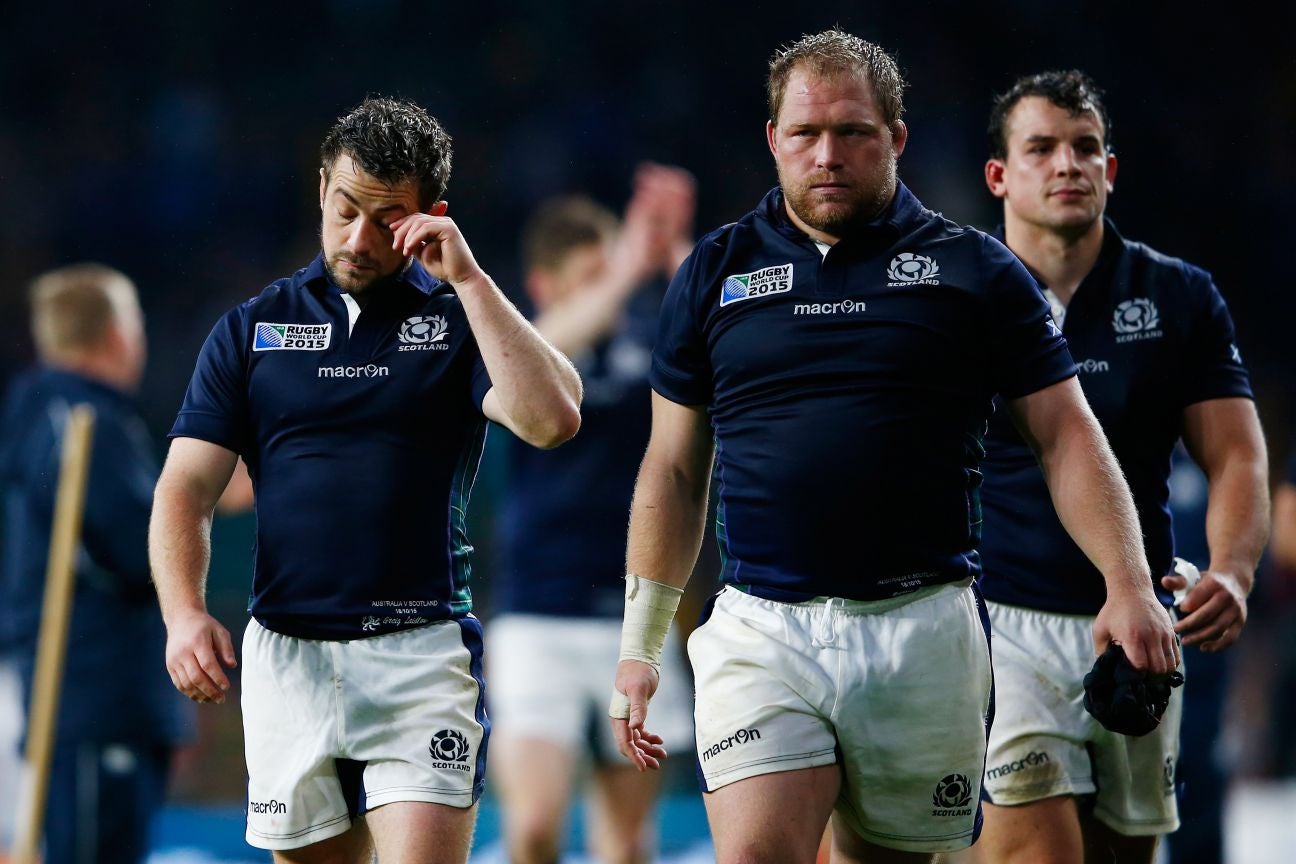 Greig Laidlaw (L) of Scotland looks dejected after the 2015 Rugby World Cup Quarter Final match between Australia and Scotland at Twickenham Stadium