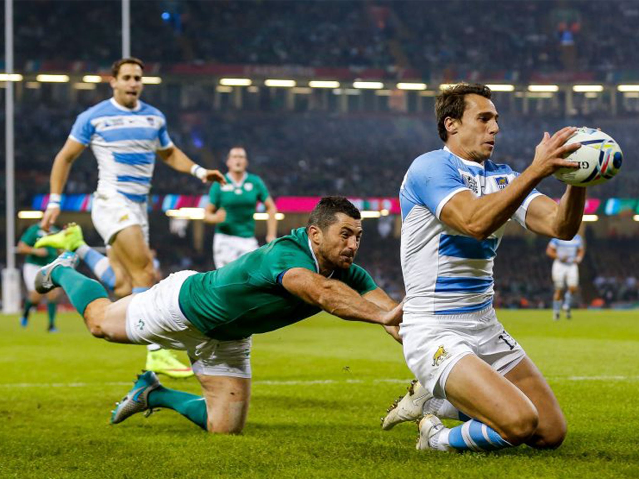 Argentina Winger Juan Imhoff gathers to score the second try of the game as Ireland Full Back Rob Kearney tackles