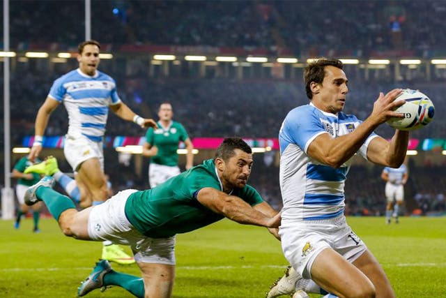 Argentina Winger Juan Imhoff gathers to score the second try of the game as Ireland Full Back Rob Kearney tackles