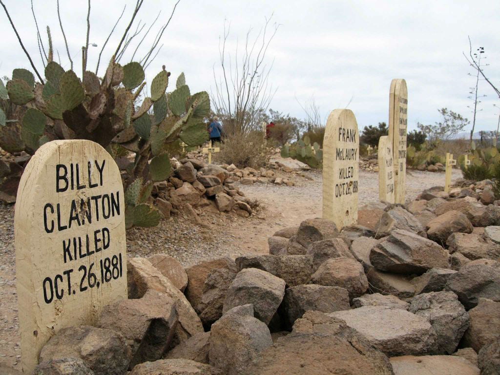 The graves of OK Corral gunfight casualties Billy Clanton, and brothers Frank and Tom McLaury, in the Boothill Graveyard on the outskirts of Tombstone