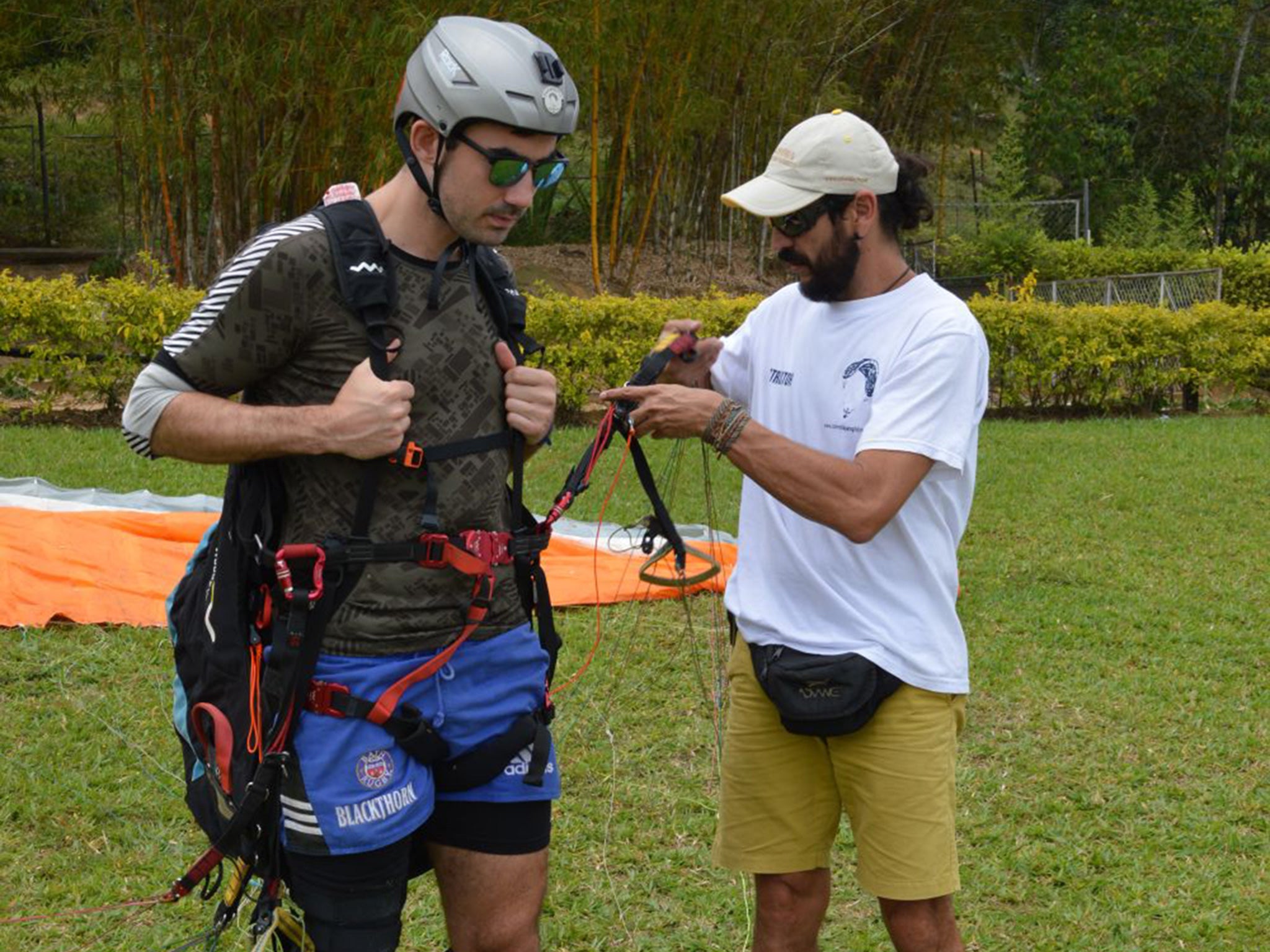 An instructor helps Simon with his kit