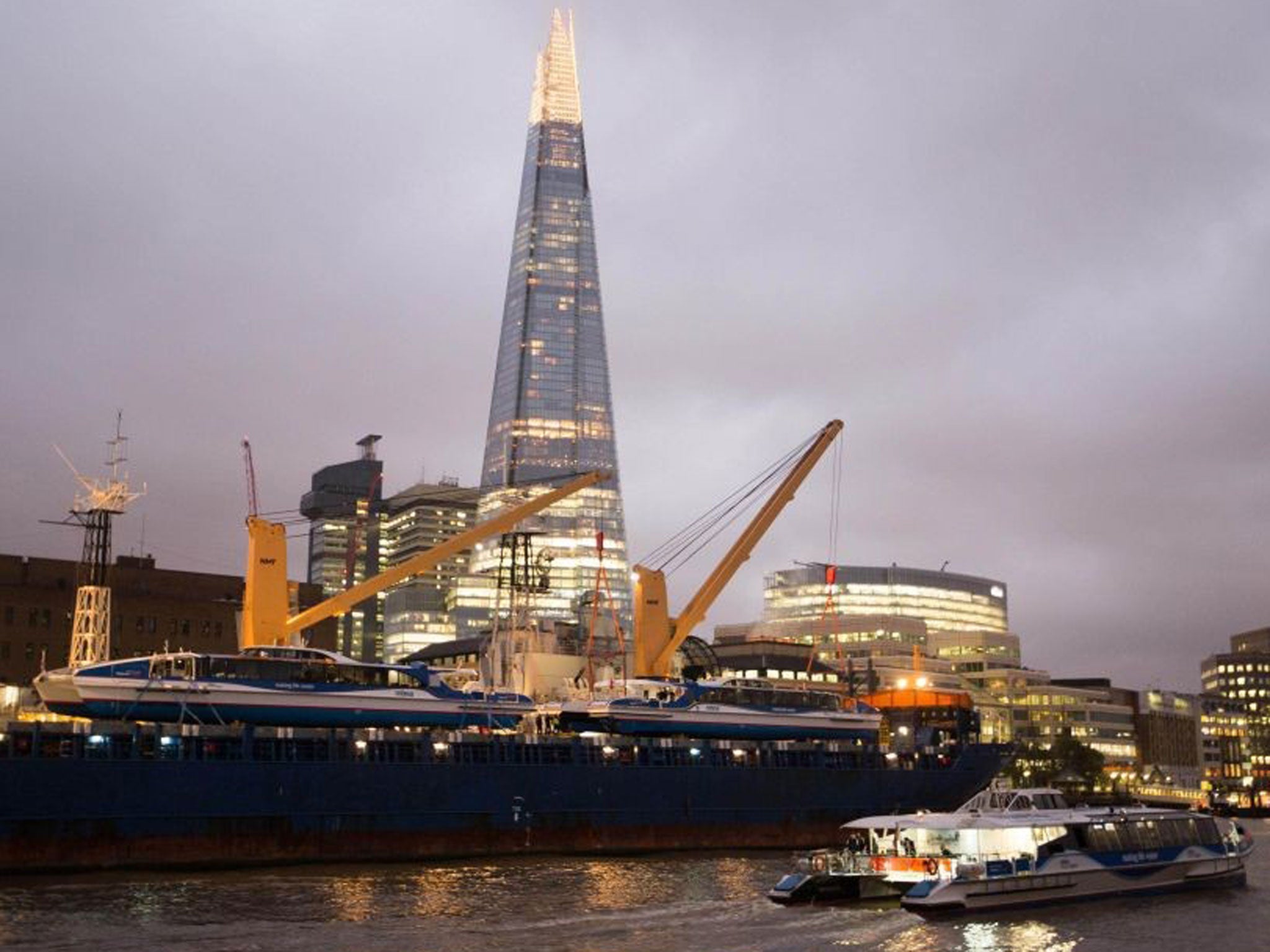 Two new catamarans - Galaxy Clipper and Neptune Clipper - that have travelled over 15,000 miles from where they were built in Tasmania, Australia arrive at their new home on the River Thames in London, to join the MBNA Thames Clippers fleet, with an older sister vessel passing by