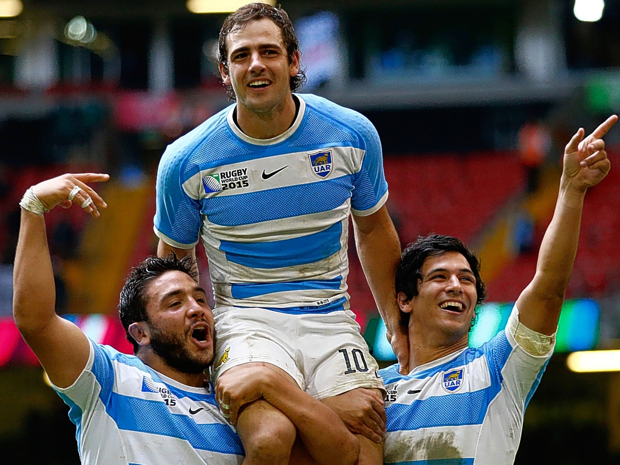 Fly-half Nicolas Sanchez is held aloft by Lucas Noguera (left) and Matias Moroni after Argentina’s win over Ireland in Cardiff
