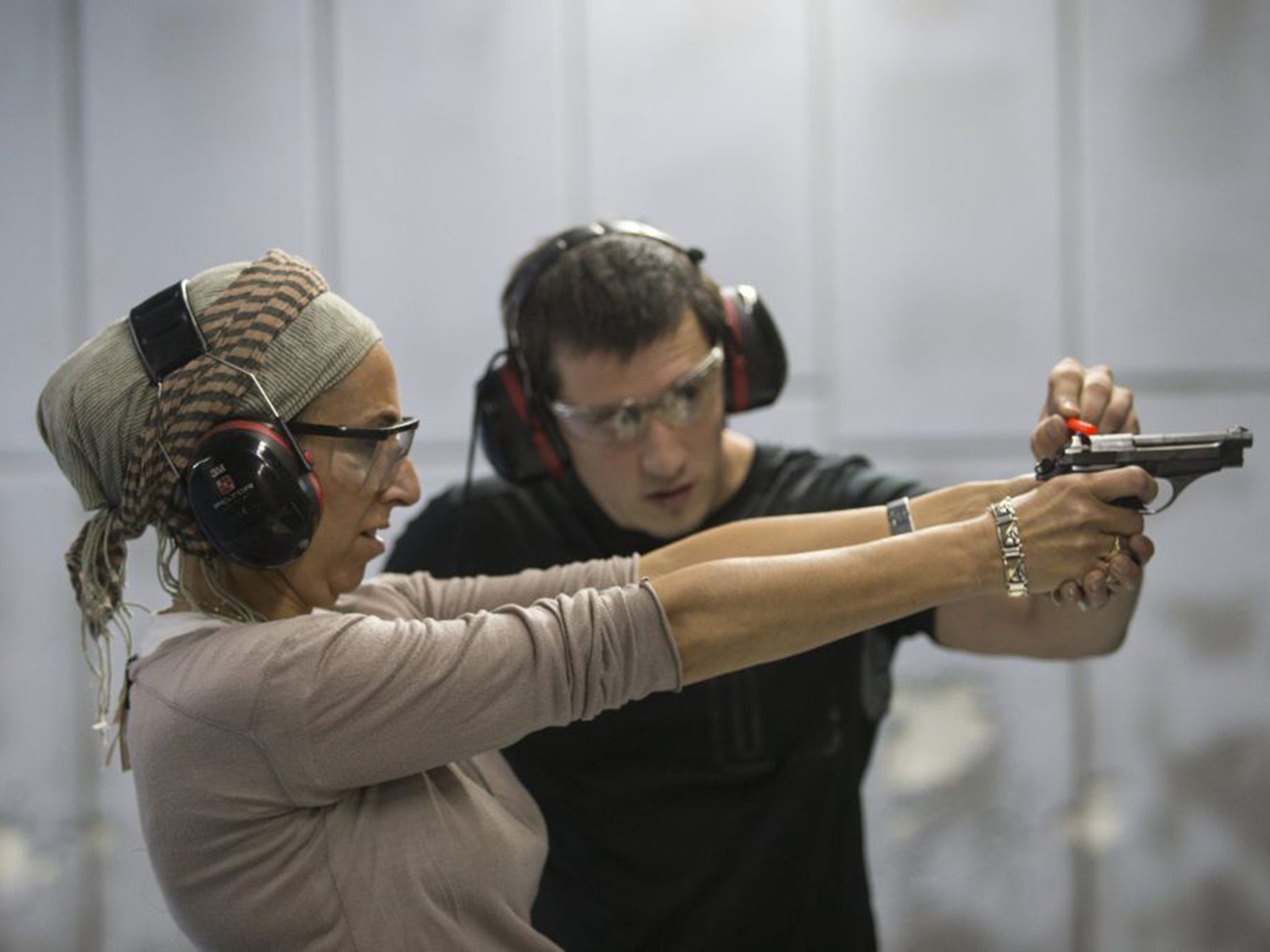An Israeli Orthodox woman practising her skills at a shooting range in Jerusalem (EPA)