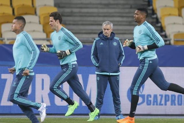 Jose Mourinho watches his players training in Kiev yesterday, with the team seeking an uplift in form