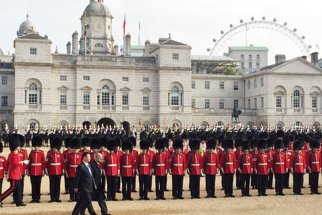 The Duke of Edinburgh accompanies President Xi Jinping, as he inspects a Guard of Honour on Horse Guards Parade