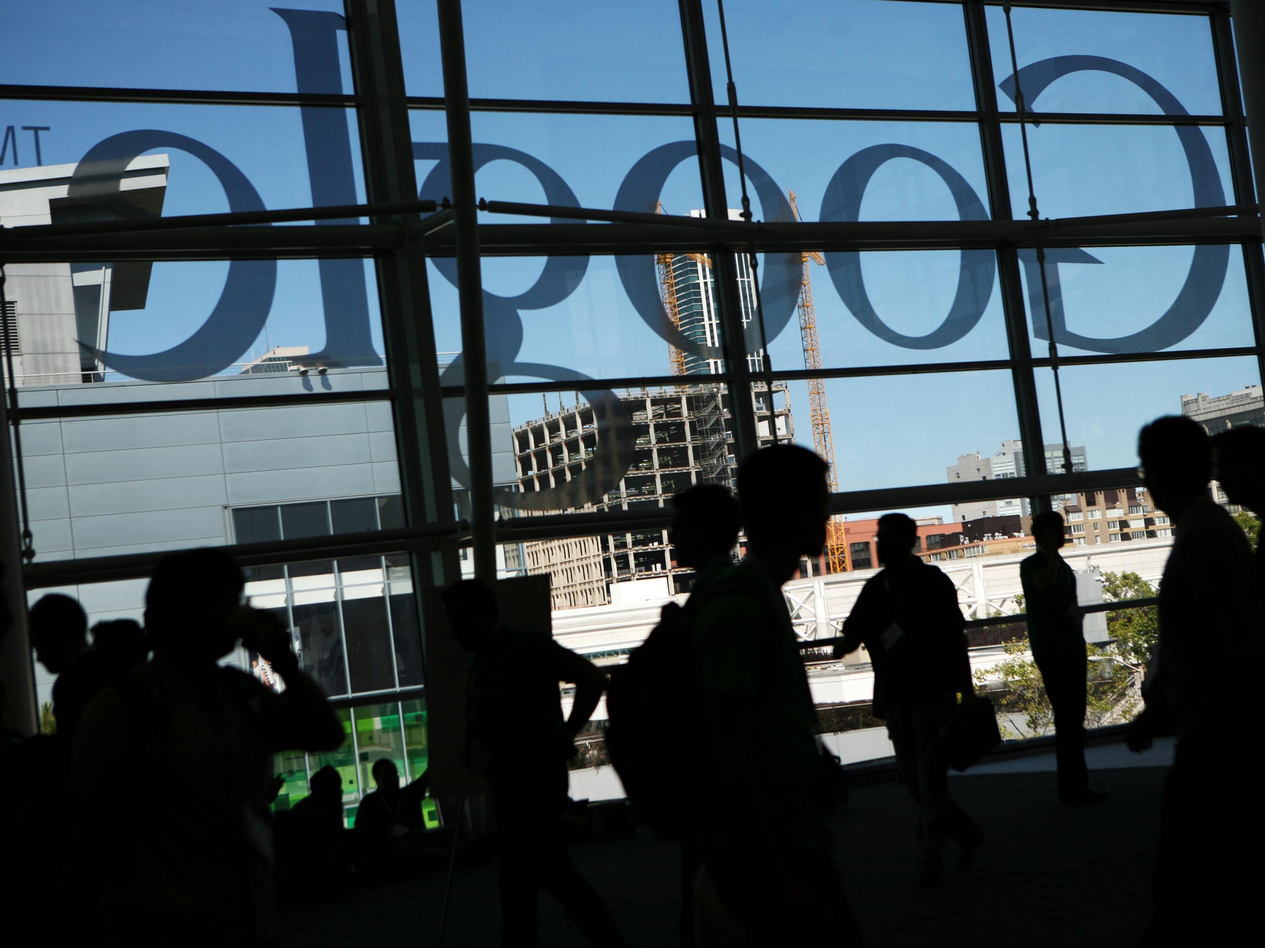 A Google logo is seen through windows of Moscone Center in San Francisco during Google's annual developer conference, Google I/O, in San Francisco