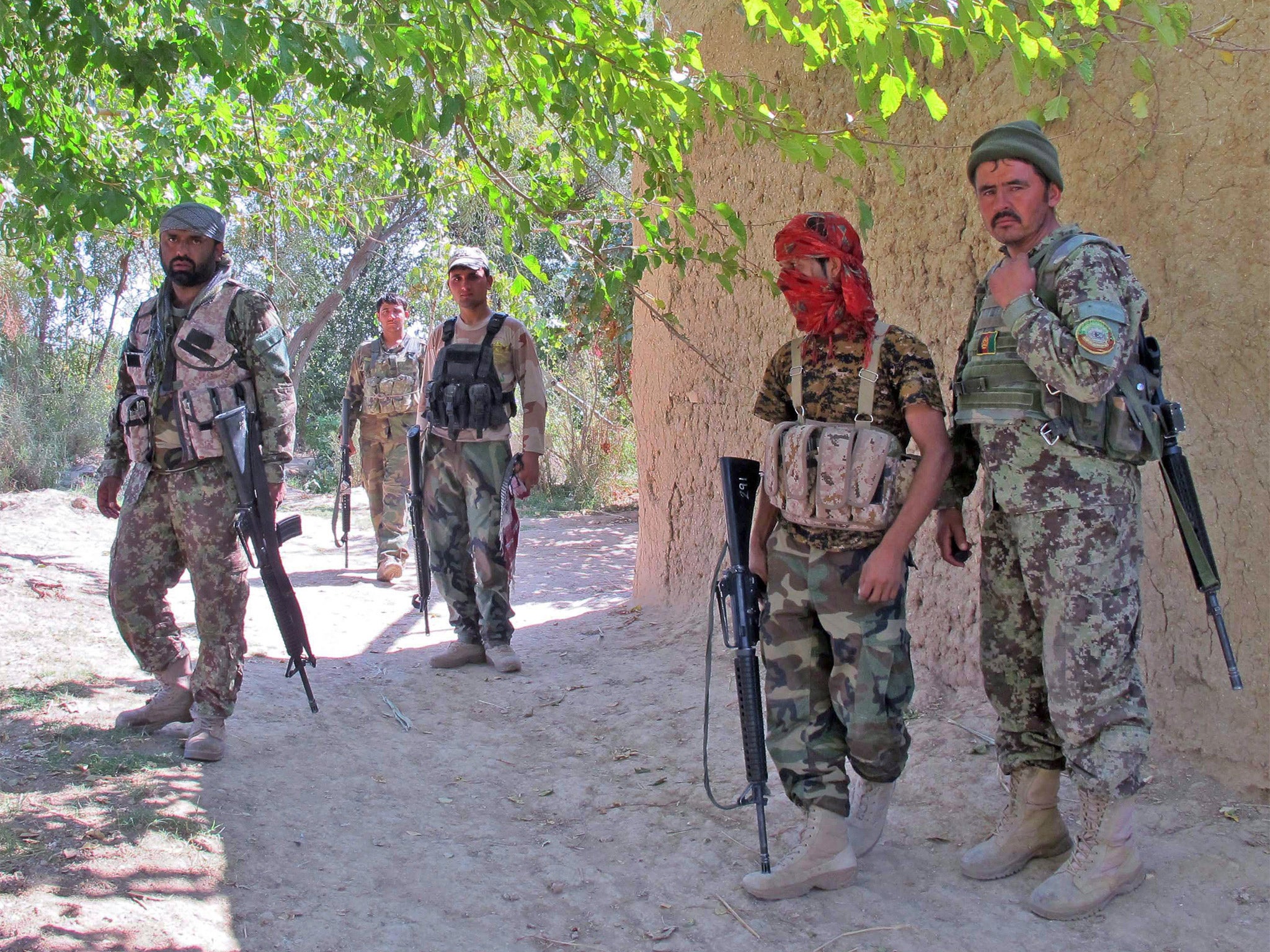 &#13;
Members of the Afghan security services on patrol following an operation against armed groups in Helmand province &#13;