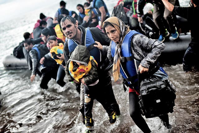 Refugees arriving on the Greek island of Lesbos on Wednesday