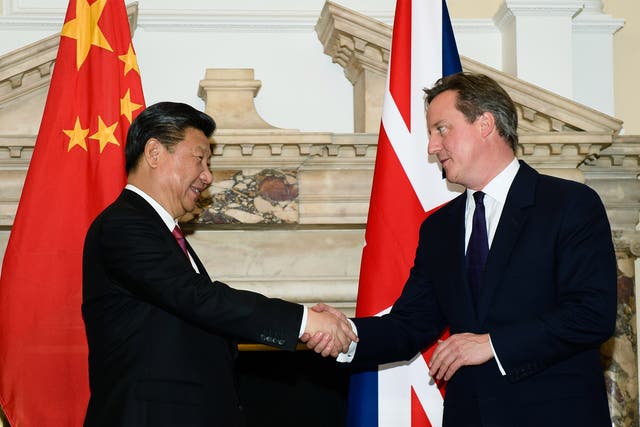 The  Prime Minister shakes hands with the President Xi Jinping during a commercial contract exchange at the UK-China Business Summit in Mansion House