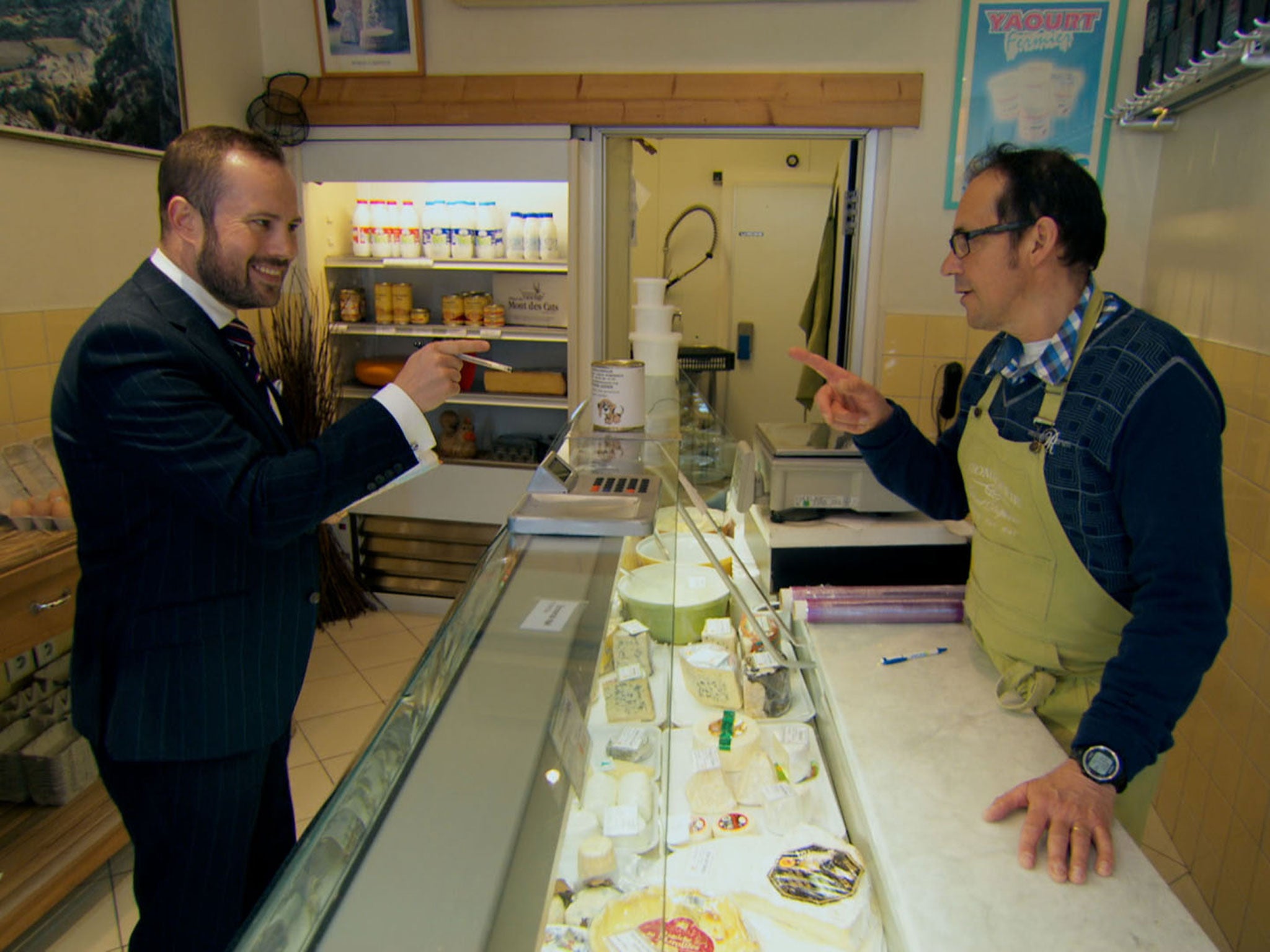 Meeting the locals: Richard Woods 'charms' a French shopkeeper