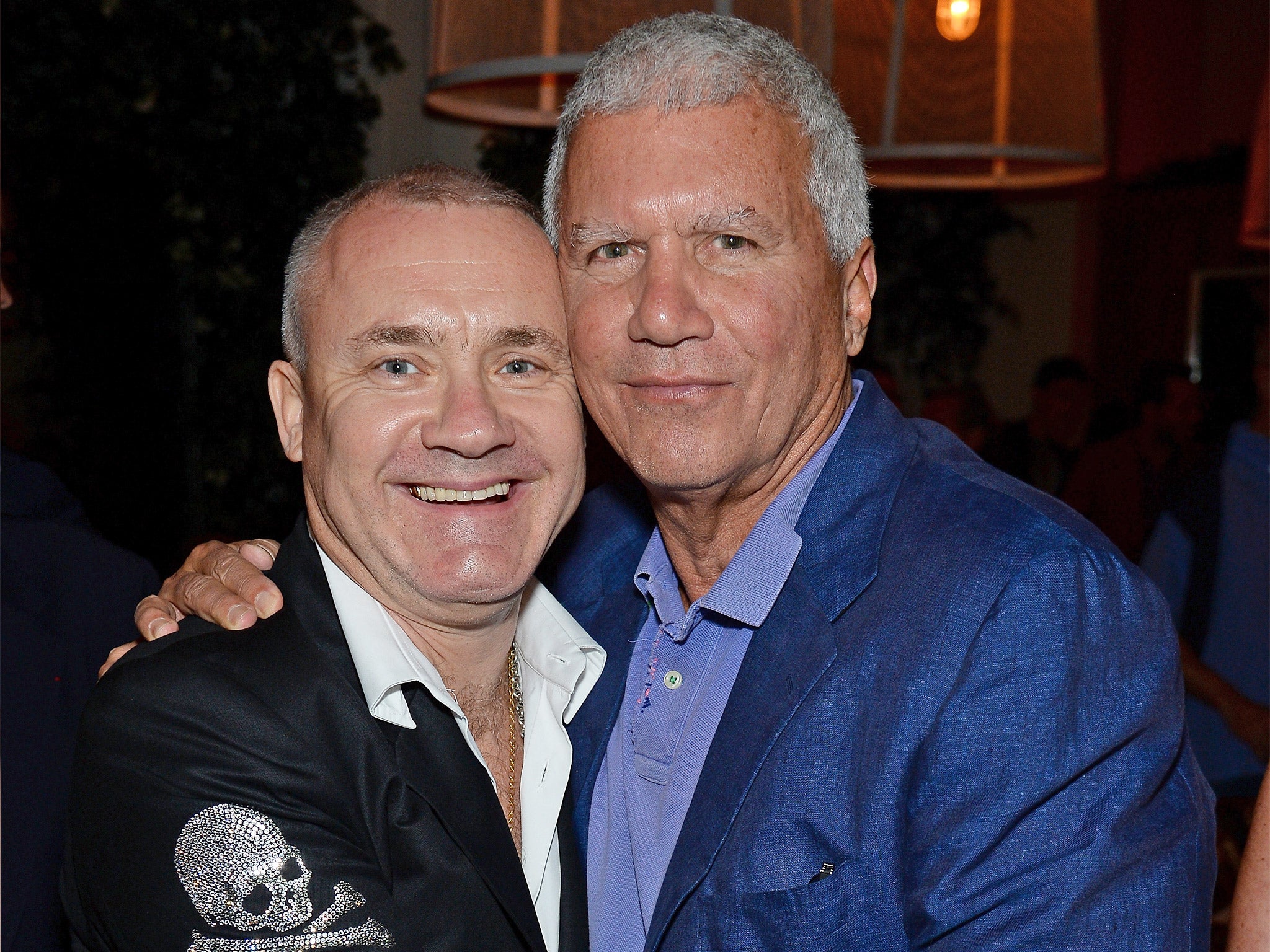 Art dealer and number six on the list, Larry Gagosian, right, with Damien Hirst in 2013 (Getty)