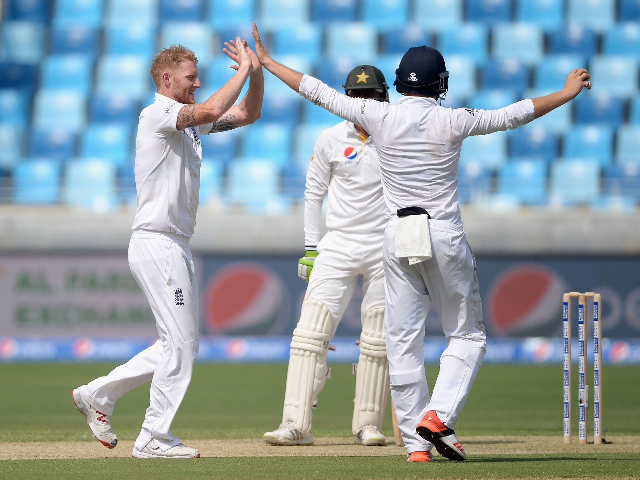 England celebrate the wicket of Shoaib Malik