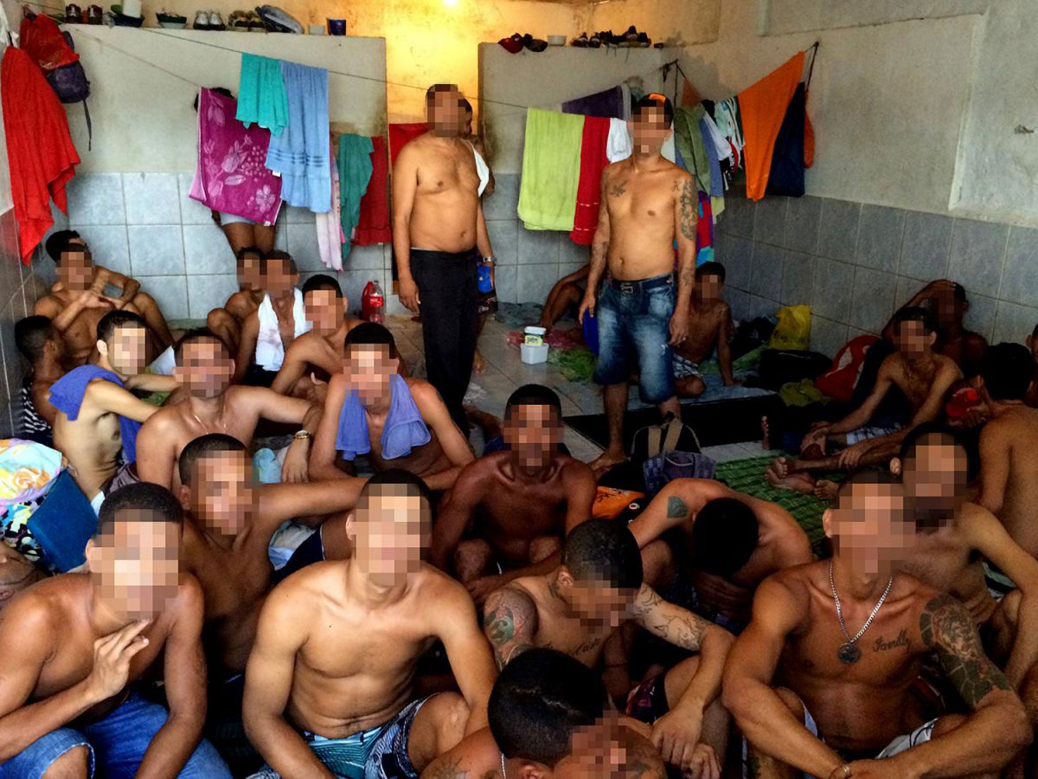 Inmates in a windowless cell in the “punishment and transfer” area at Presídio Juiz Antônio Luiz L. de Barros, in Recife.