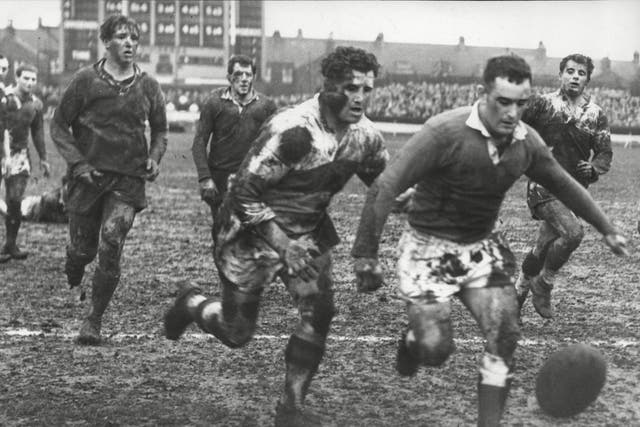 Turner, third right, in the white shirt, chases the ball for Wakefield against Hull KR