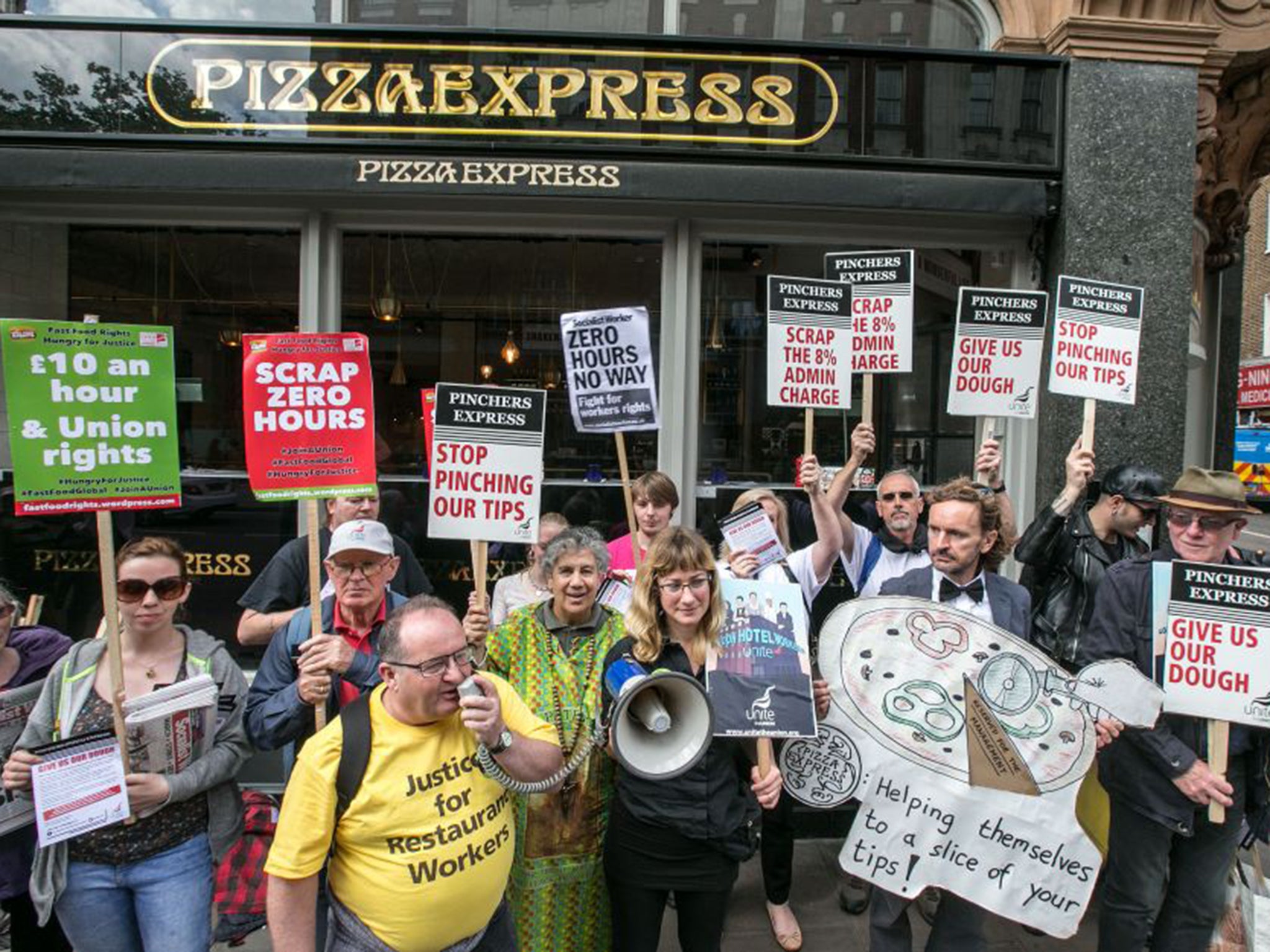 Support staff: Unite’s Dave Turnbull, speaking, leads restaurant workers in protest against ‘tip-skimming’ by Pizza Express, which then ended the practice (Mark Thomas)