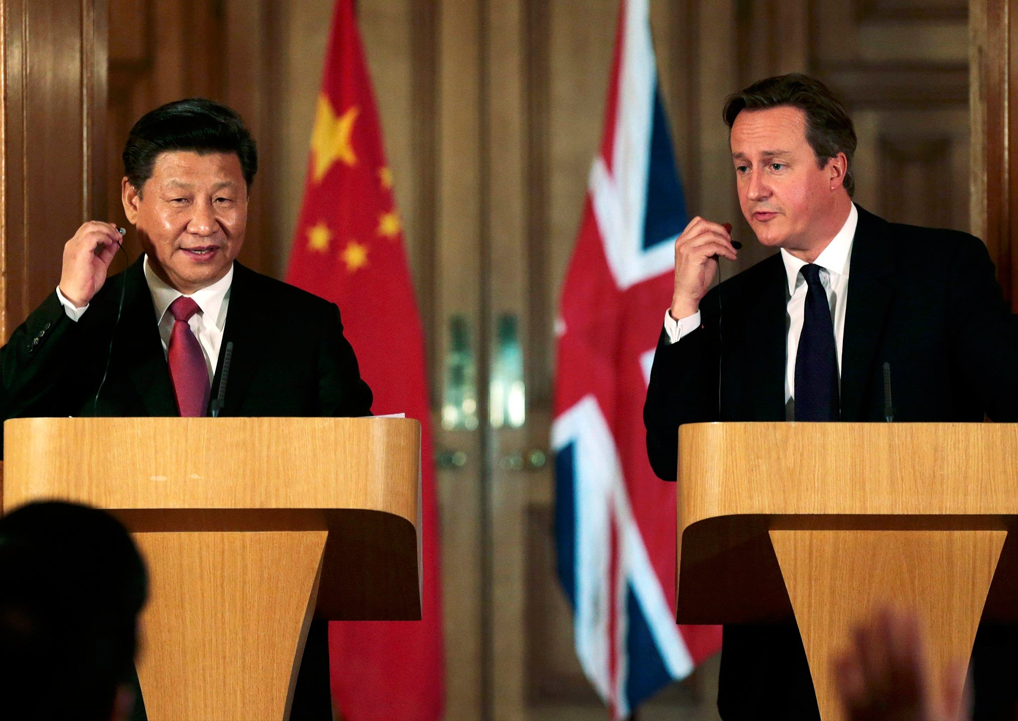 Xi Jinping and David Cameron attend a joint press conference in 10 Downing Street