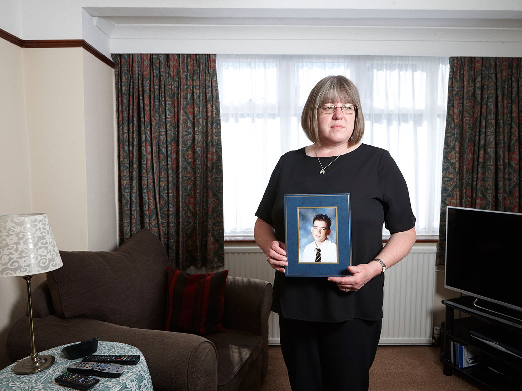 Sally Evans with a photograph of her son, Thomas, who was shot dead by the Kenyan army