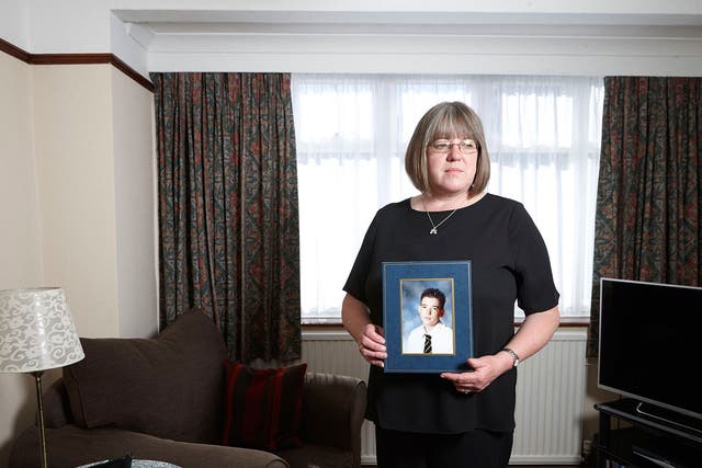Sally Evans with a photograph of her son, Thomas, who was shot dead by the Kenyan army