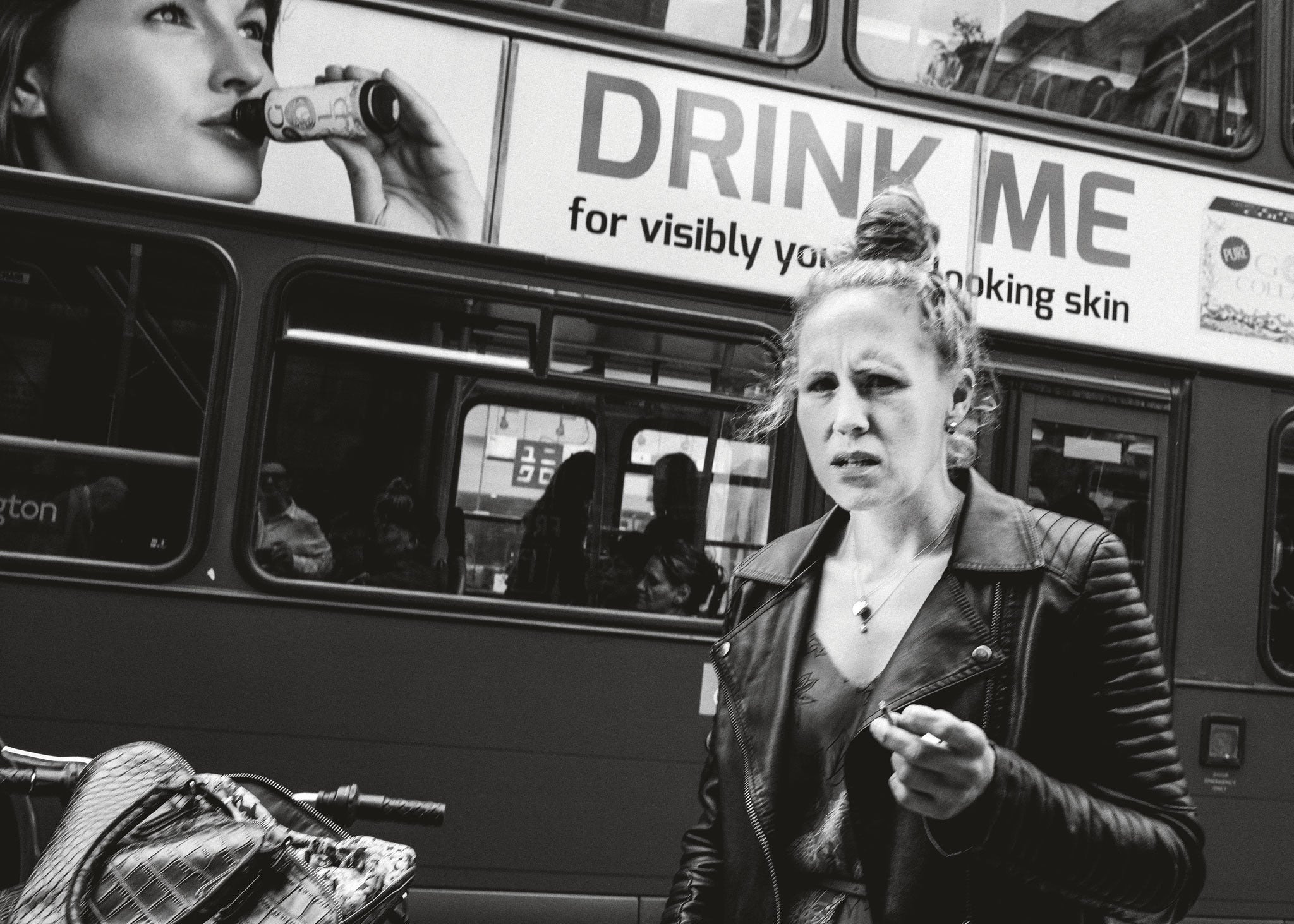 Words inscribed on shop fronts or passing buses seem to reflect, often ironically, on the experience of the human subjects