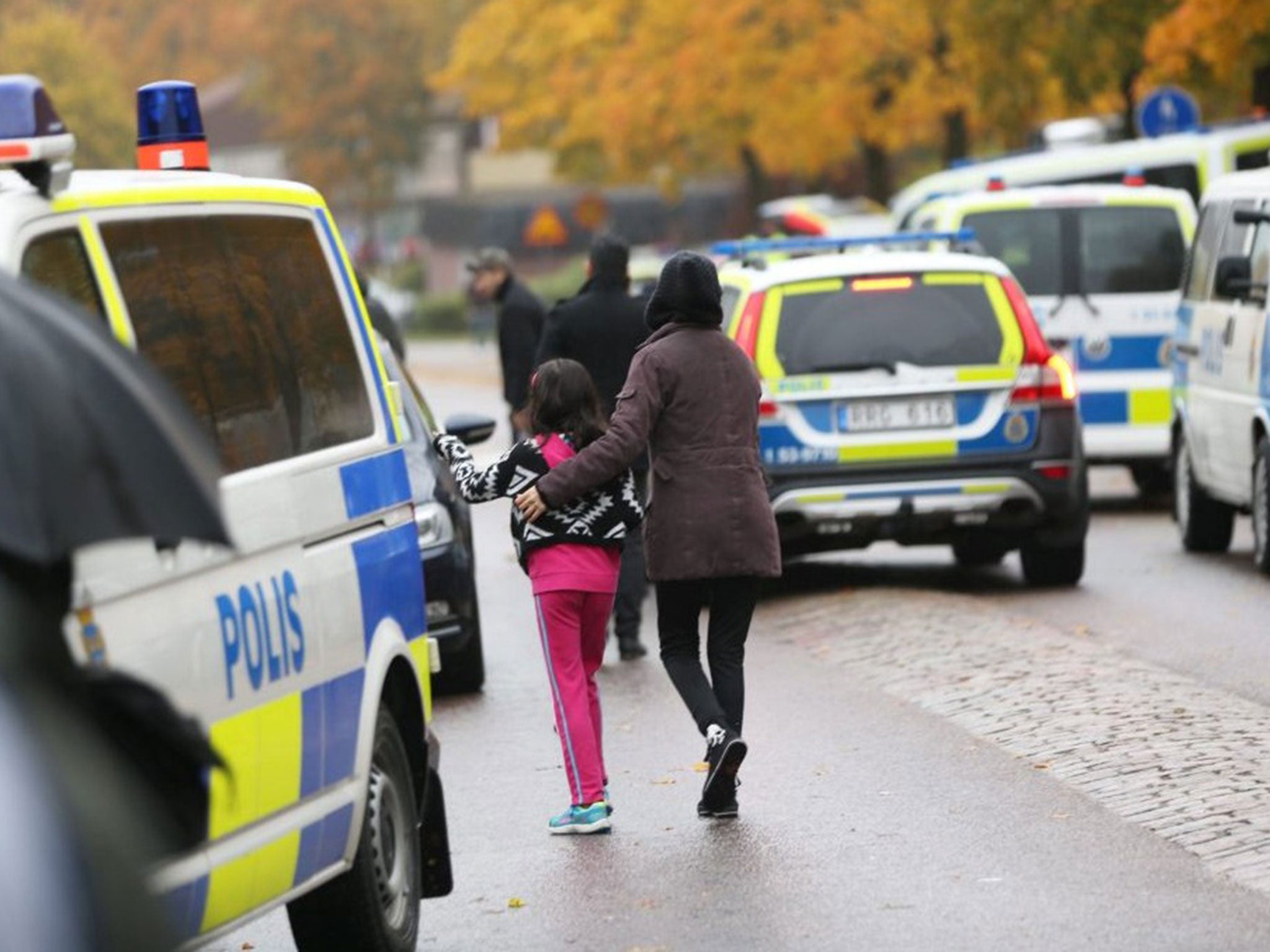 Students and parents leaving the Kronan school after the attack