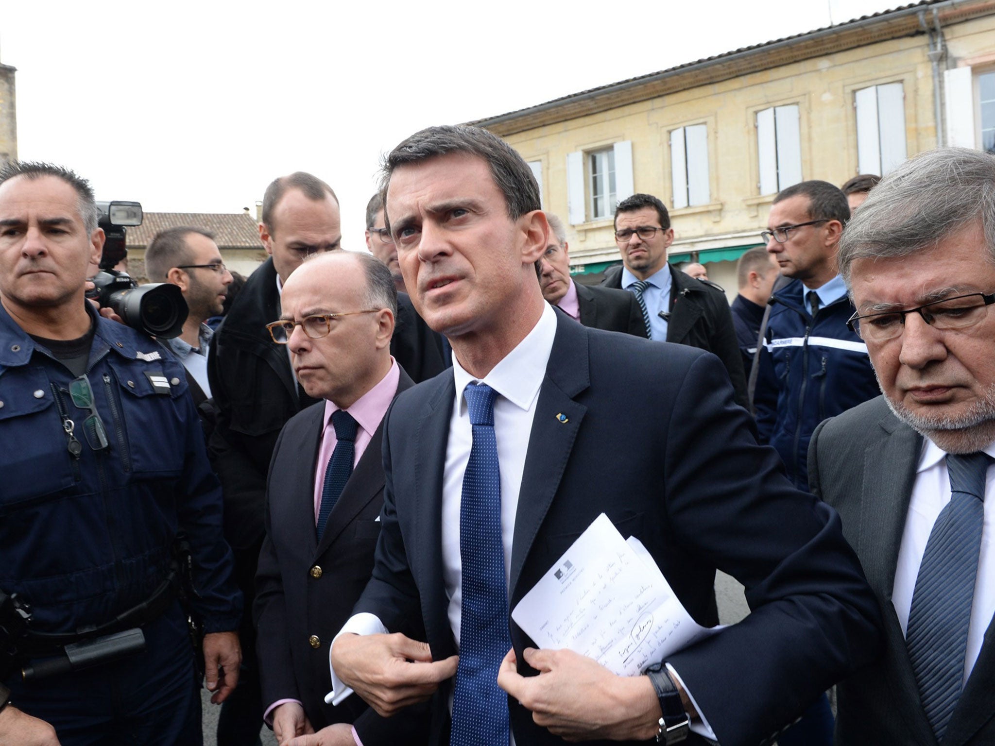 Manuel Valls and Bernard Cazeneuve at the site of the crash in Puisseguin